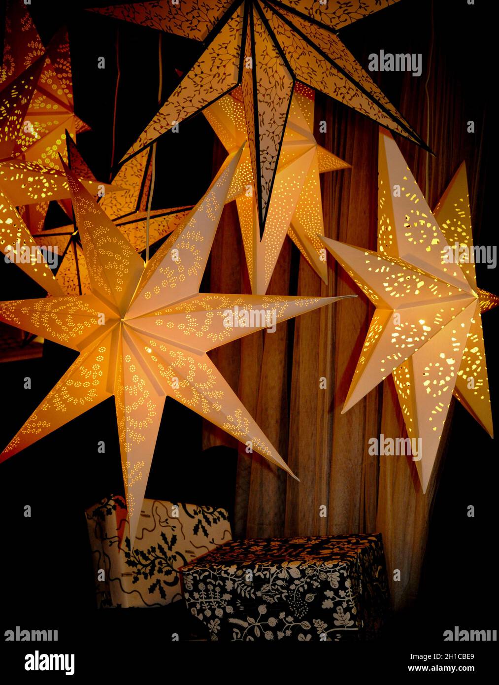 A display of light up paper star hanging decorations, IKEA, Sheffield Stock Photo