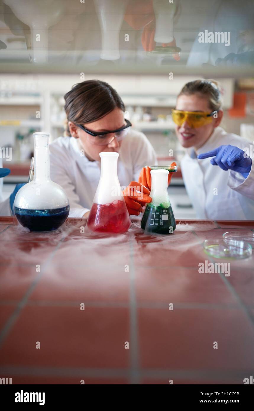 Scientist in chemical lab research vaccine against virus covid-19 Stock Photo
