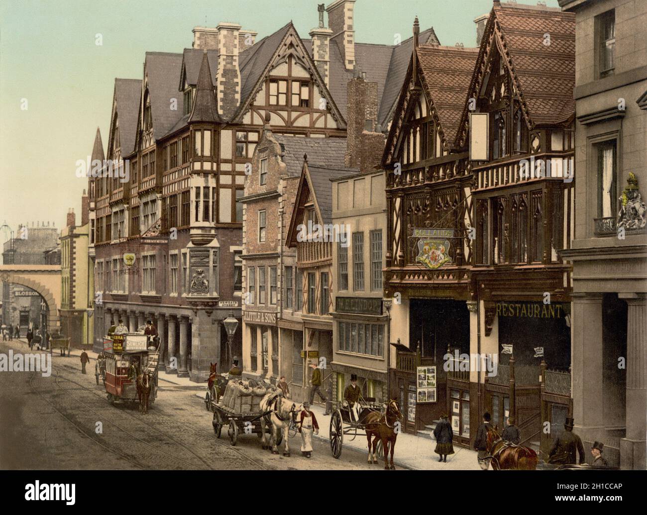 Vintage photochrome colour photo circa 1890 of Eastgate Street in Chester an historic town in England dating back to the medieval period.  The view includes the Tudor period buildings and rows in the city centre also the Grosvenor Hotel.  A horse drawn tram operated by the Chester Tramways Company can be seen Stock Photo