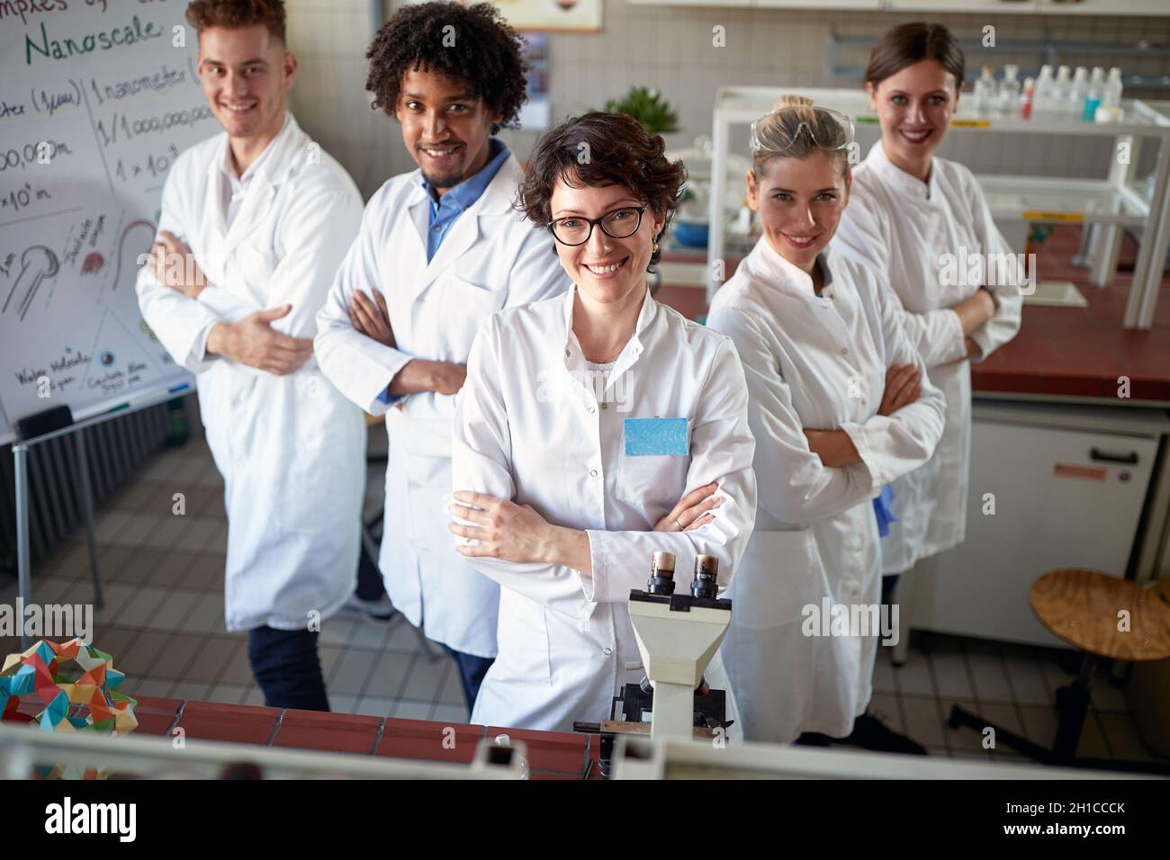 Young lab technicians together in chemical laboratory Stock Photo