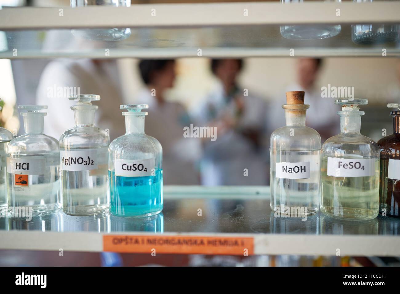 Bottles with different chemicals on the shelf in a sterile laboratory