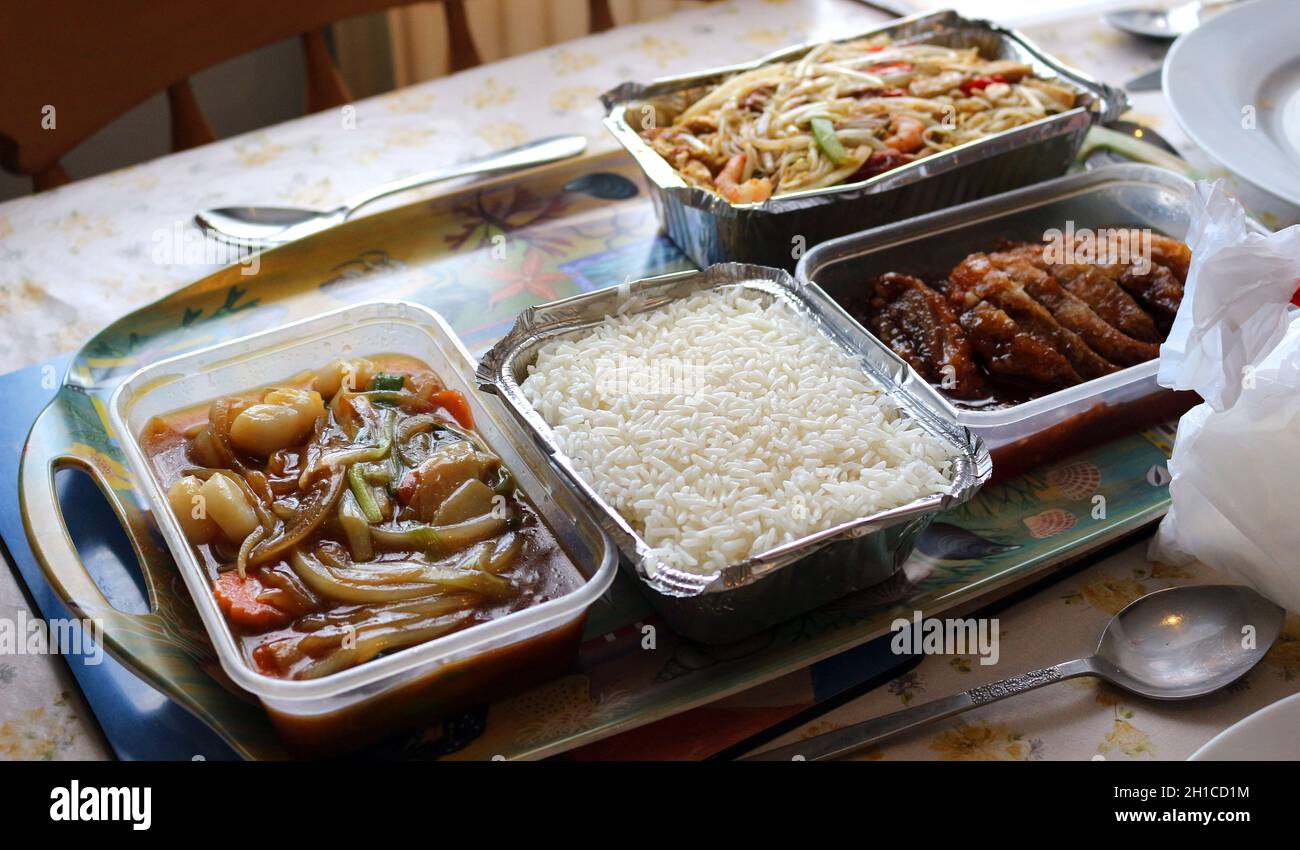 Chinese take away dishes in foil and plastic trays Stock Photo