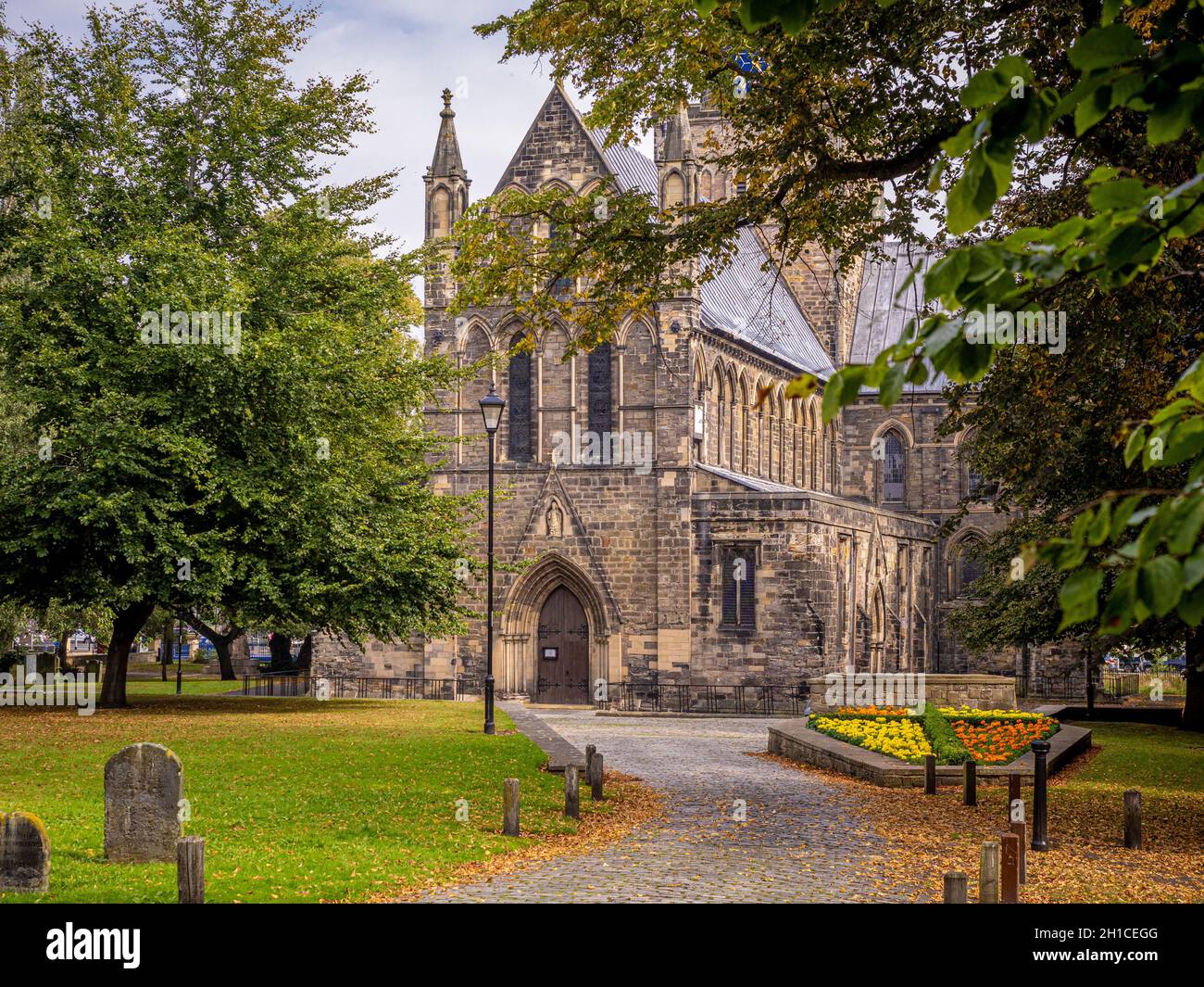 West front of St Cuthbert's Church exterior seen from the graveyard