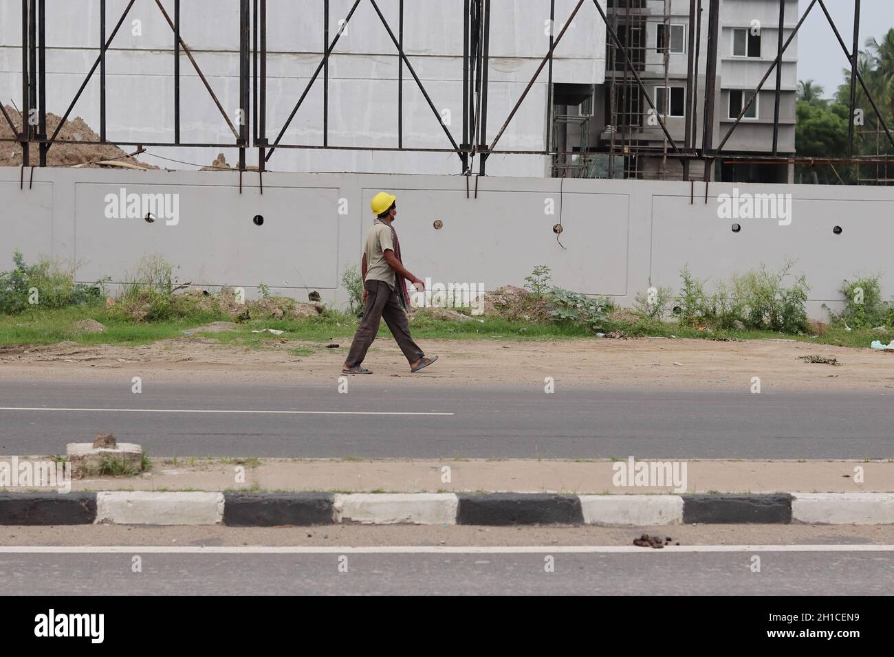 Chennai Tamil nadu, India 18 Oct 2021.A laborer walking on the road