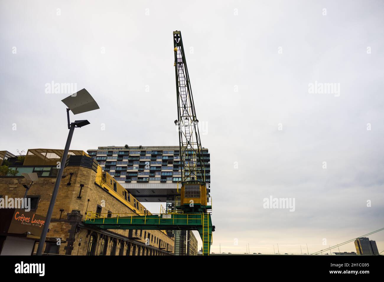 Low angle shot of an industrial crane in Cologne, Germany Stock Photo ...