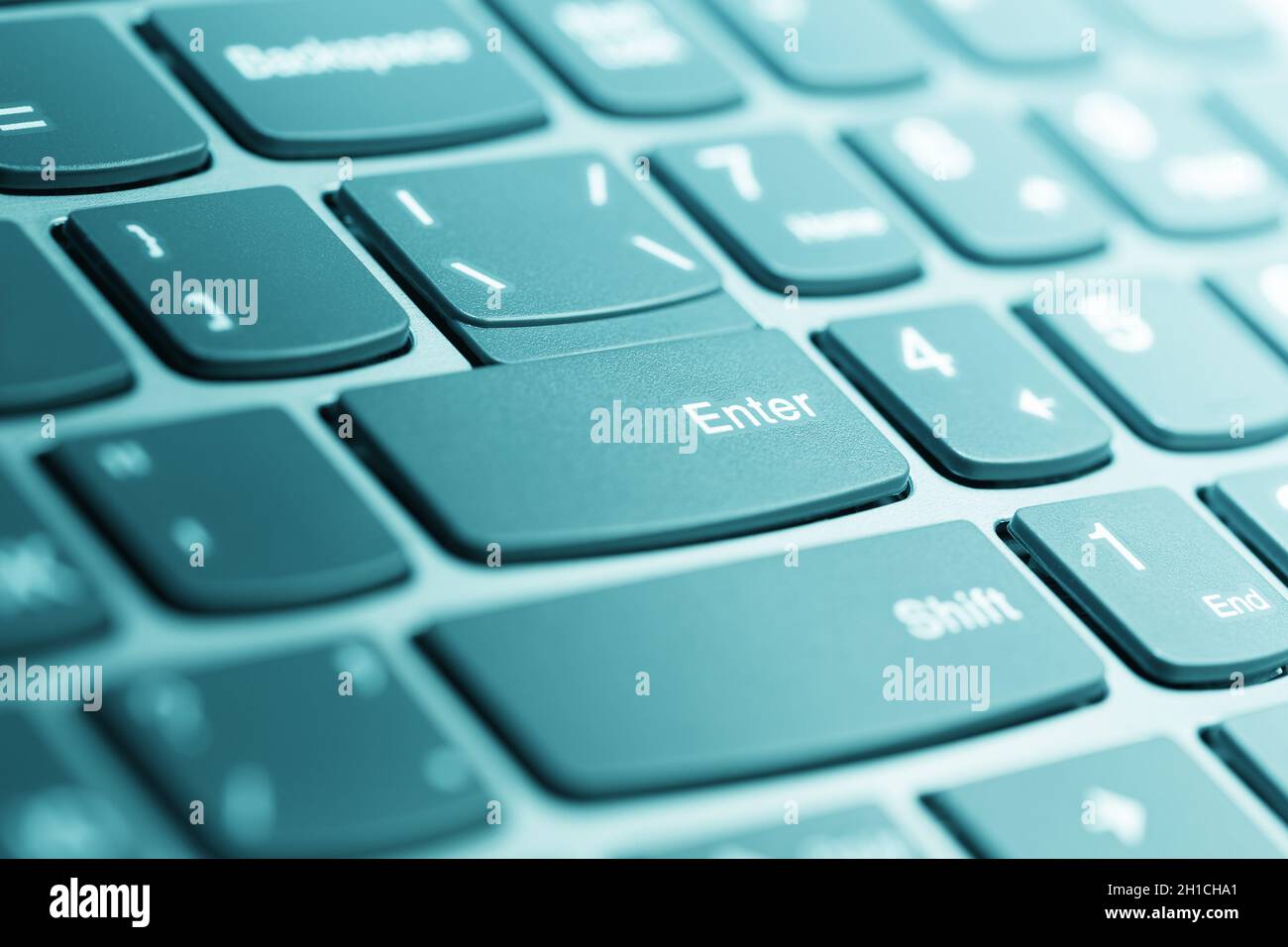 Laptop keyboard. Photo with shallow depth of field, toned in aqua Stock Photo