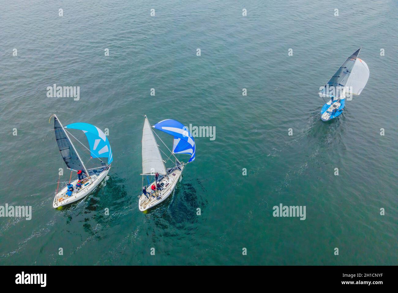 Aerial bird's eye view photo taken by drone of sailboat in turquoise ...