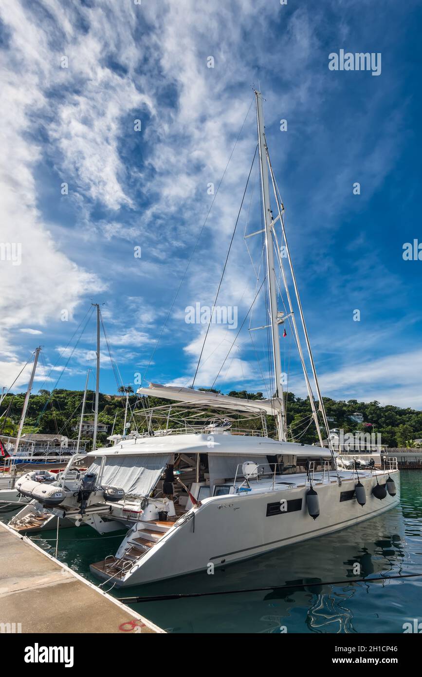 English Harbour, Antigua and Barbuda - December 18, 2018: Sail catamaran docked at the Antigua yacht club in English Harbour, St. Paul’s Parish, Antig Stock Photo