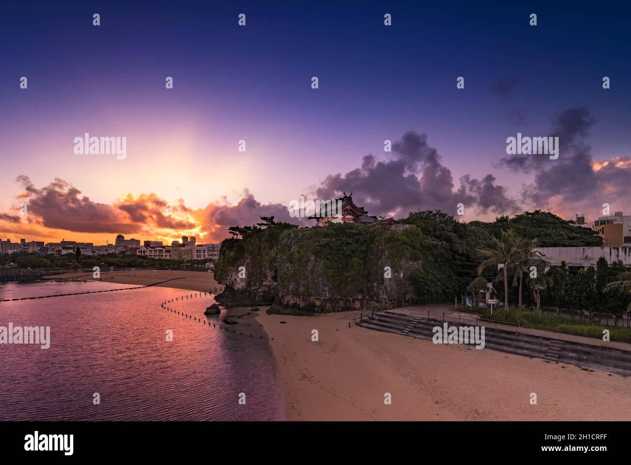 Sunrise landscape of the Shinto Shrine Naminoue at the top of a cliff overlooking the beach and ocean of Naha in Okinawa Prefecture, Japan. Stock Photo