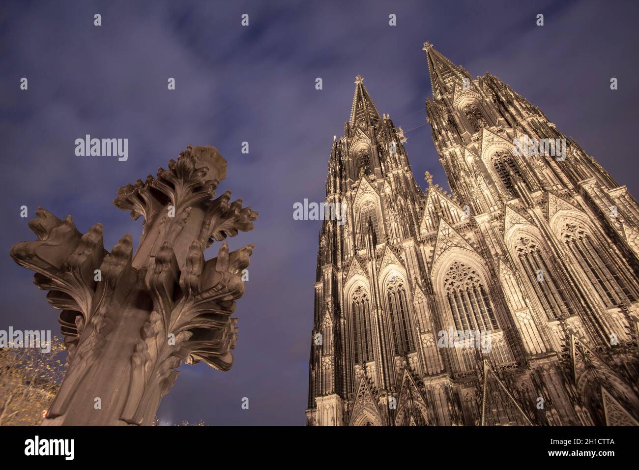 model of the finial in front of the west facade of the cathedral, the finials are on top of the steeples, Cologne, Germany.  Modell der Kreuzblume vor Stock Photo