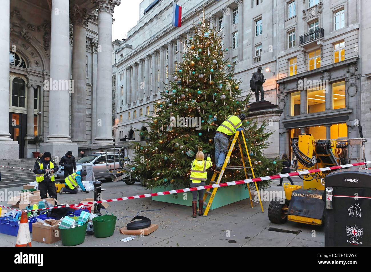 LONDON, UNITED KINGDOM - NOVEMBER 23: Decorating Christmas tree in London on NOVEMBER 23, 2013. Workers erected big Christmas tree in front of Royal E Stock Photo