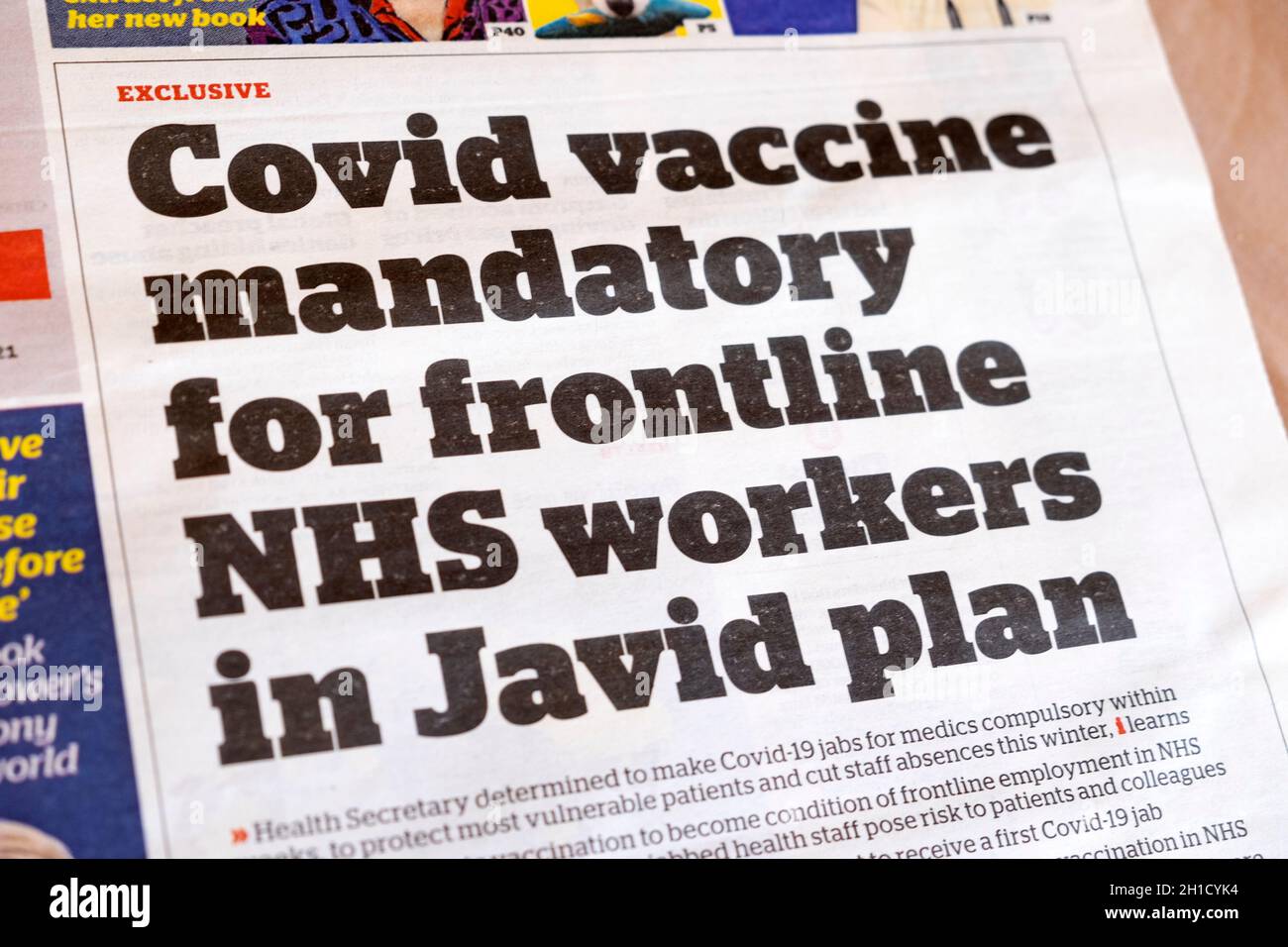 'Covid vaccine mandatory for frontline NHS workers in Javid plan' i newspaper headline front page coronavirus news 5 October 2021 London England UK Stock Photo