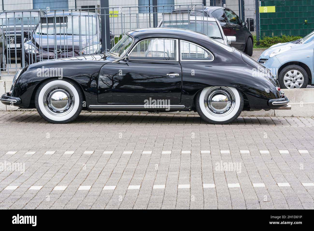 VELBERT, NRW, GERMANY - APRIL 06, 2016: Black vintage Porsche 1600 with whitewall tires on a car park in Velbert city center, Germany. Stock Photo