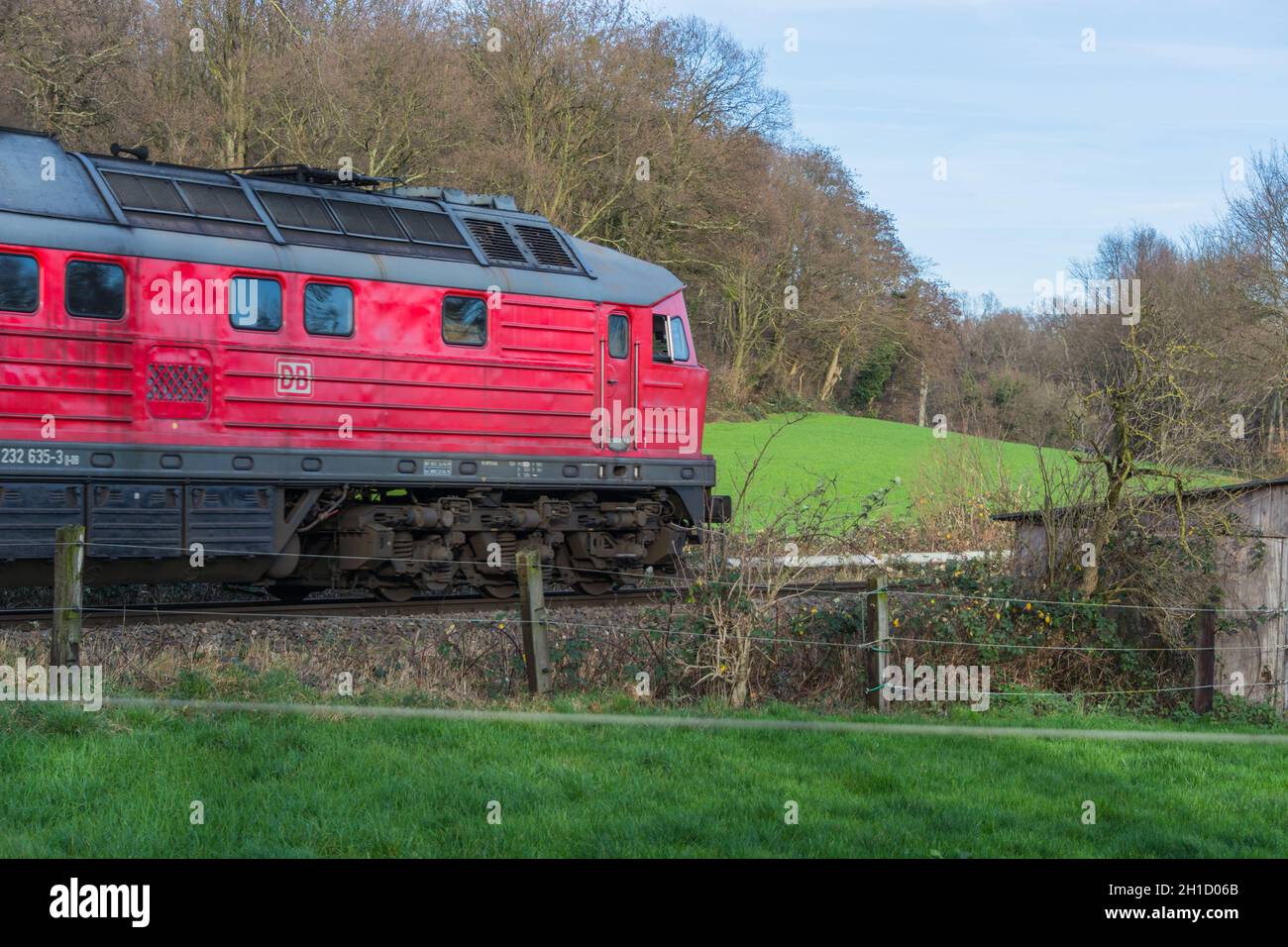 RATINGEN, NRW, GERMANY - DECEMBER 28, 2015: Locomotive at the railroad crossing in Ratingen at the moated castle 'house to house'. By propelled fast t Stock Photo