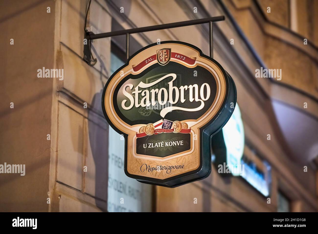 BRNO, CZECH REPUBLIC - April 14, 2018: Starobrno brewery sign on a pub in Brno at night Stock Photo