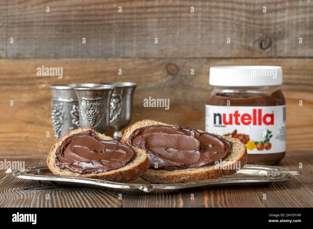 SUMY, UKRAINE - MARCH 12, 2020:  Slices of bread with nutella- world famous Italian hazelnut cocoa spread Stock Photo