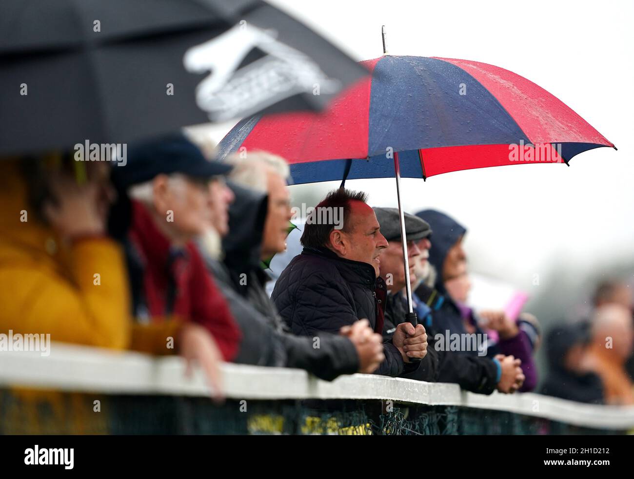 Spectators watch the Northern Commercials Iveco And Fiat Restricted Novice Stakes at Pontefract Racecourse, West Yorkshire. Picture date: Monday October 18, 2021. Stock Photo