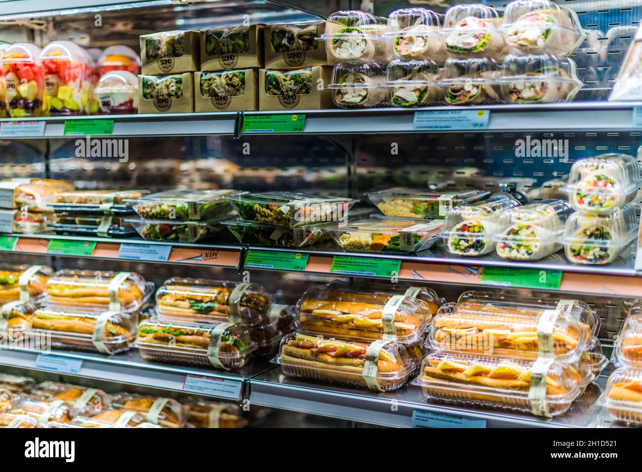 DOHA, QATAR FEB 28, 2020 Prepackaged foods displayed in a commercial refrigerator Stock