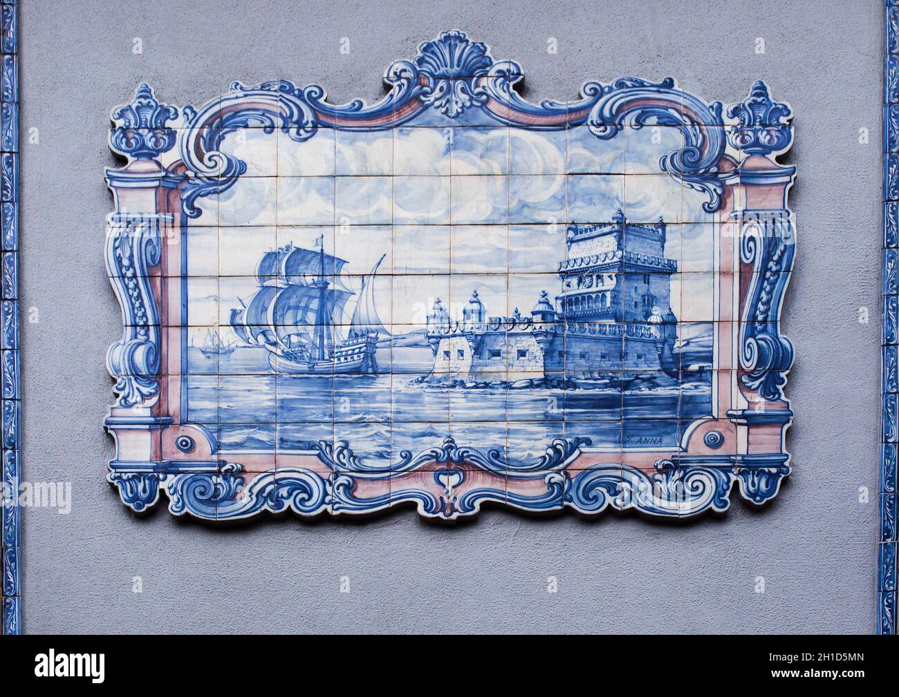 Lisbon, Portugal - March the 1st, 2020: Glazed tile wall depicting Belem Tower at 16th Century with sailing boat departure. Scene made by Sant’Anna Fa Stock Photo