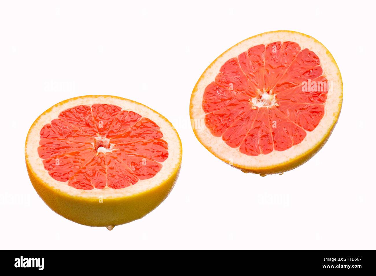 Fresh grapefruit slices, isolated on a white background Stock Photo