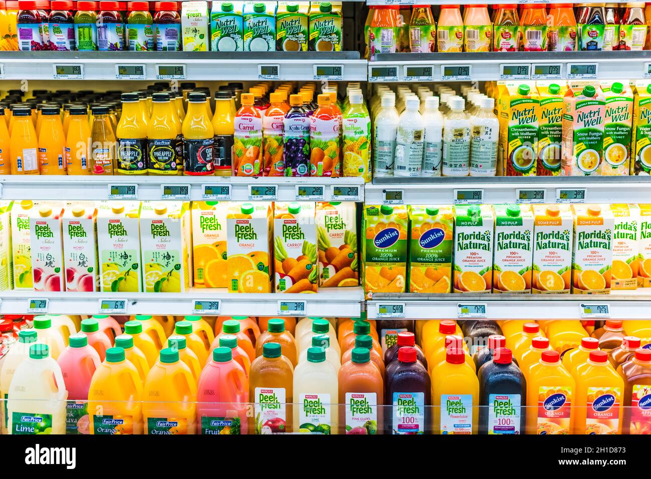 Orange juice bottles in refrigerator Stock Photo - Alamy