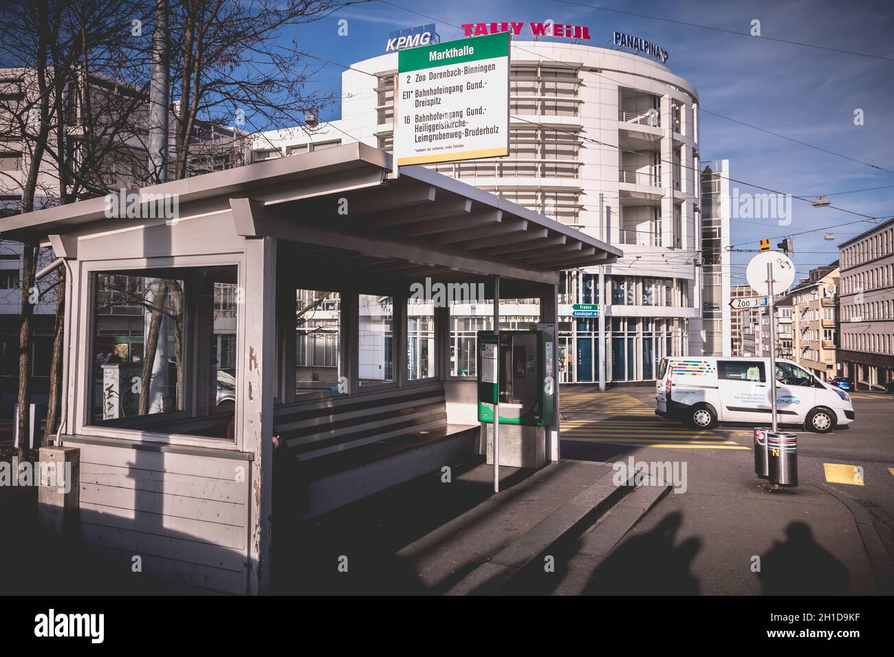 Basel, Switzerland - December 25, 2017: View of a bus stop for lines 2 E11 and 16 in the city center on a winter day Stock Photo