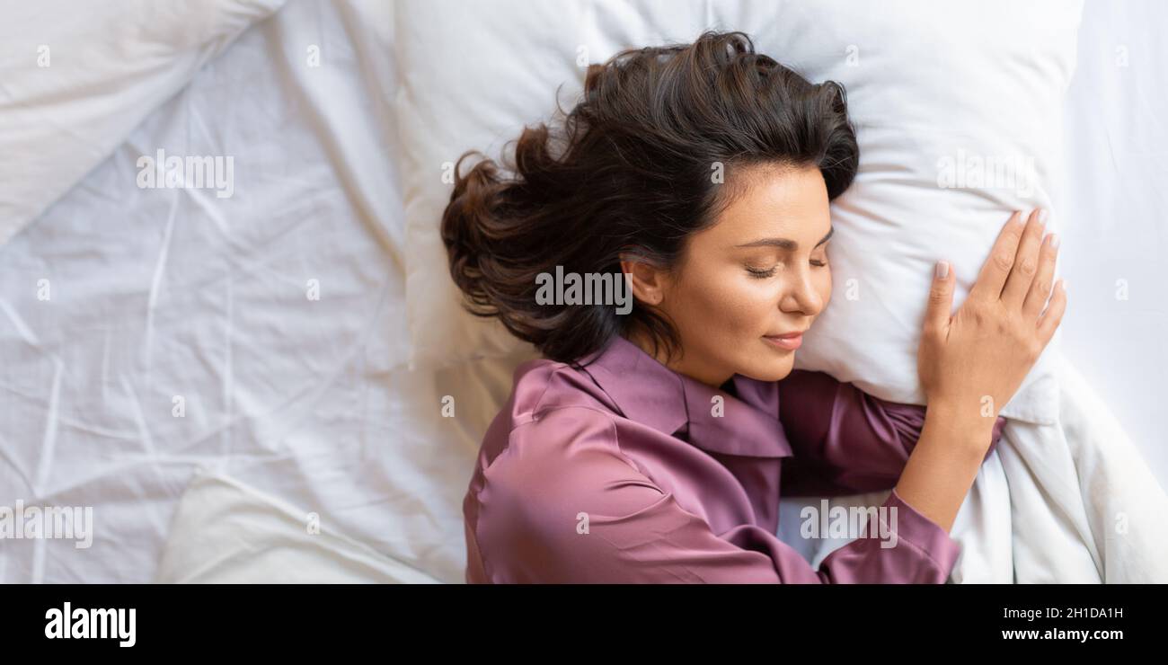 Early morning - beautiful middle-aged woman asleep. Healthy sleep and recovery concept. Stock Photo