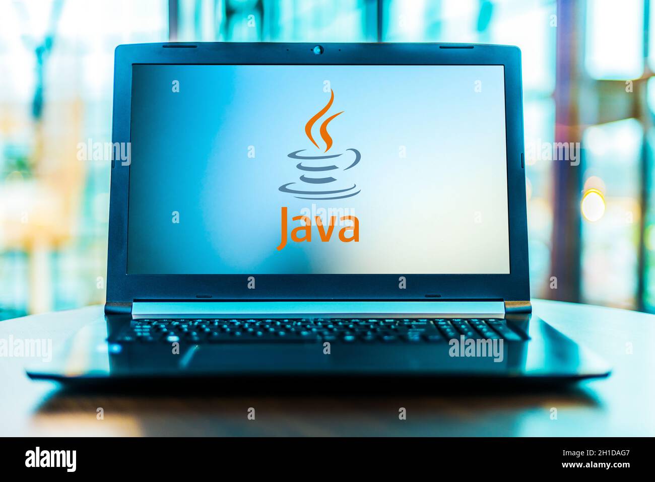 POZNAN, POL - MAR 24, 2020: Laptop computer displaying logo of Java, a general-purpose programming language developed by Sun Microsystems Stock Photo