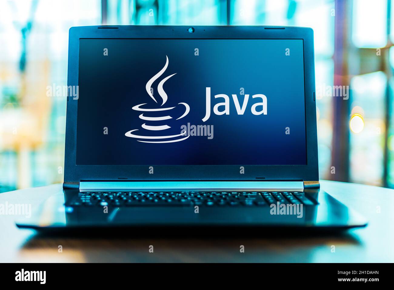 POZNAN, POL - MAR 24, 2020: Laptop computer displaying logo of Java, a general-purpose programming language developed by Sun Microsystems Stock Photo