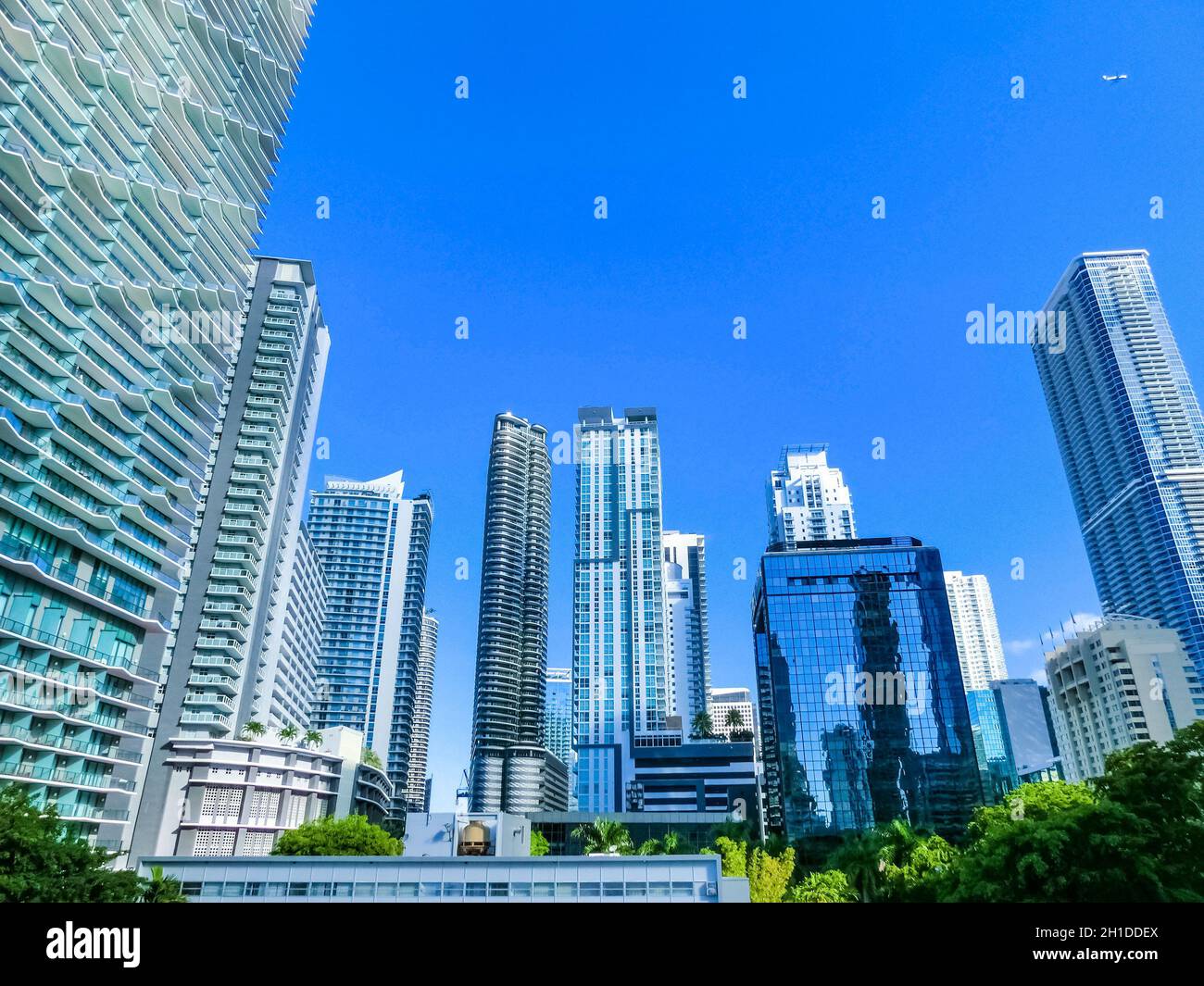 Downtown Miami cityscape view with condos and office buildings against blue sky. Stock Photo