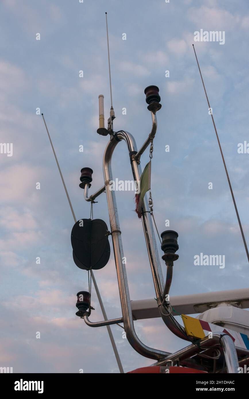Antennas and position lights of fishing boat in harbor Stock Photo Alamy