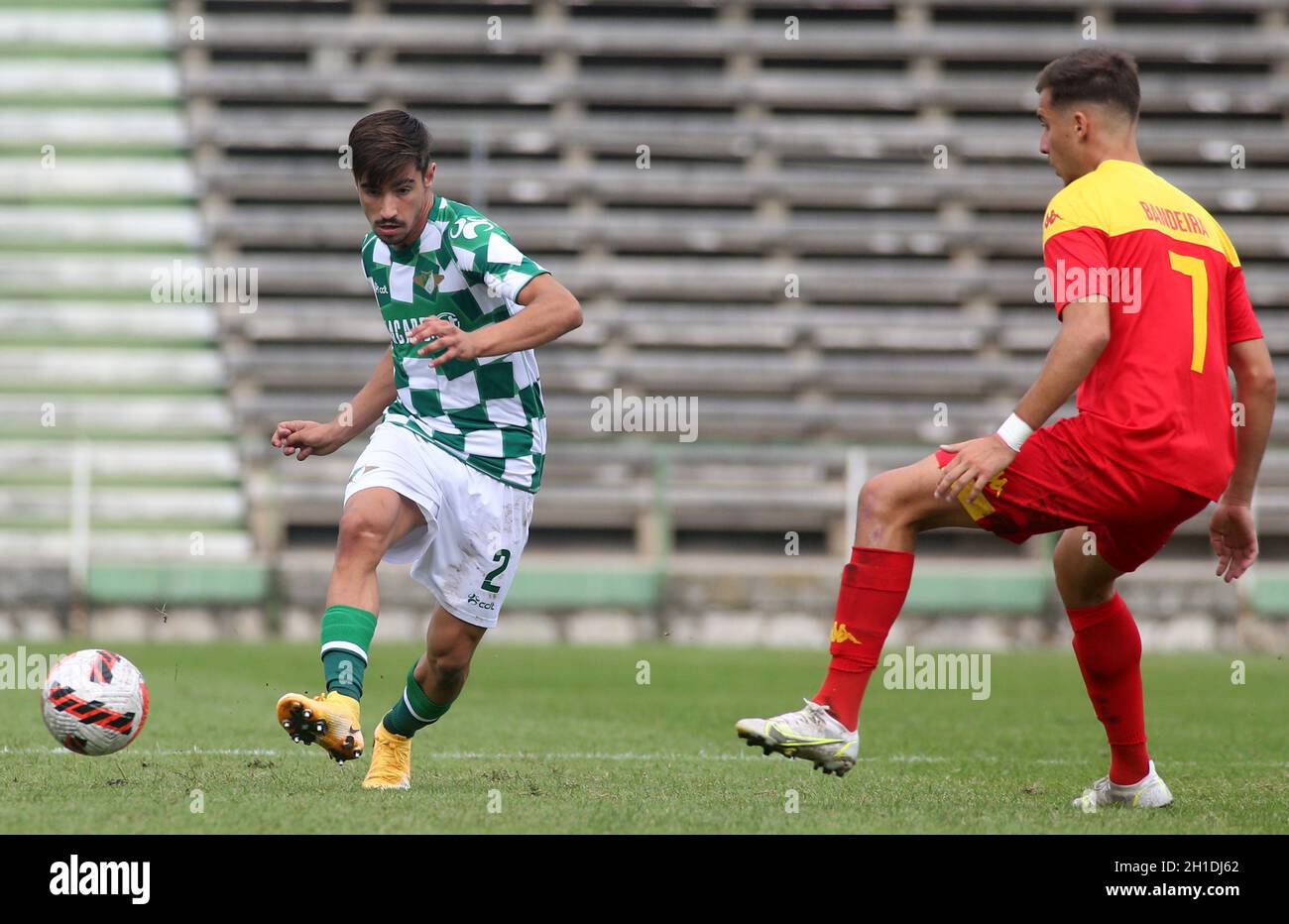 LAVRADIO, PORTUGAL - OCTOBER 16: Rodrigo Conceicao of Moreirense FC  competes for the ball with Bandeira of Oriental Dragon FC ,during the  Portuguese Cup match between Oriental Dragon FC and Moreirense FC