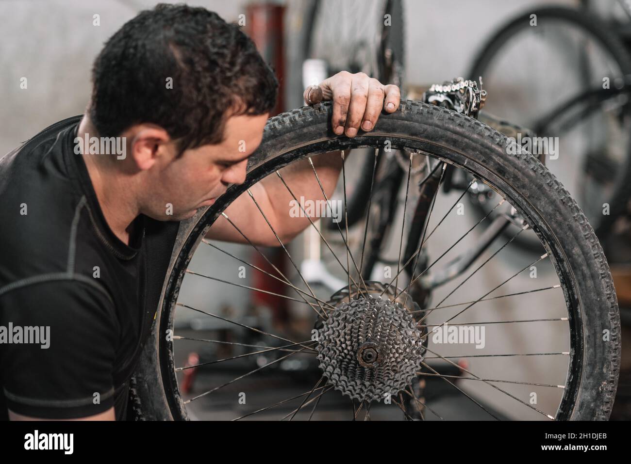 Bicycle mechanic in a workshop in the repair process Stock Photo - Alamy