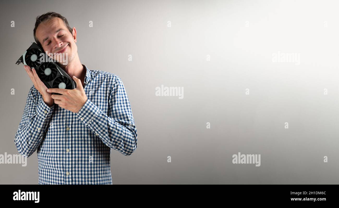 A man holding a video card  Stock Photo