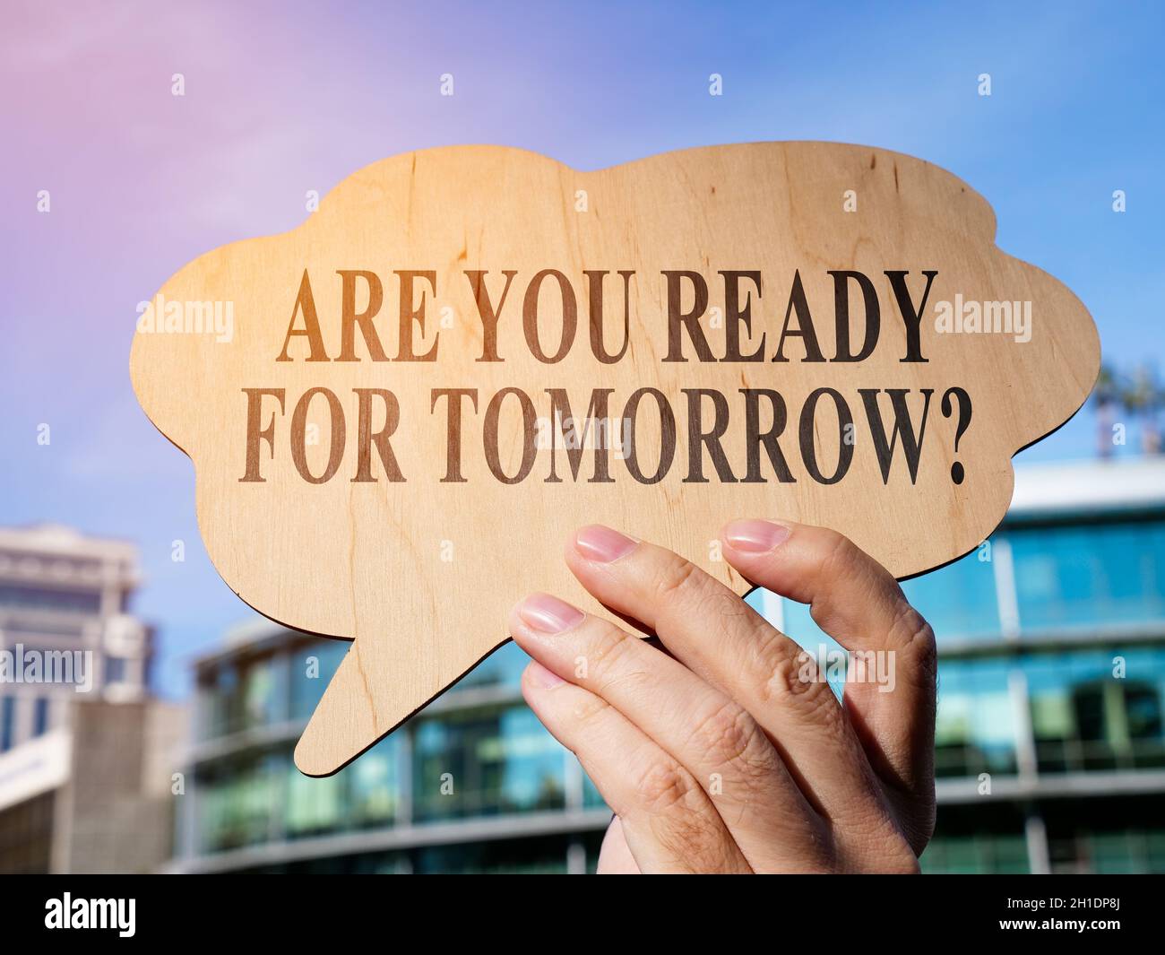 A hand holds an inspiration quote are you ready for tomorrow. Stock Photo