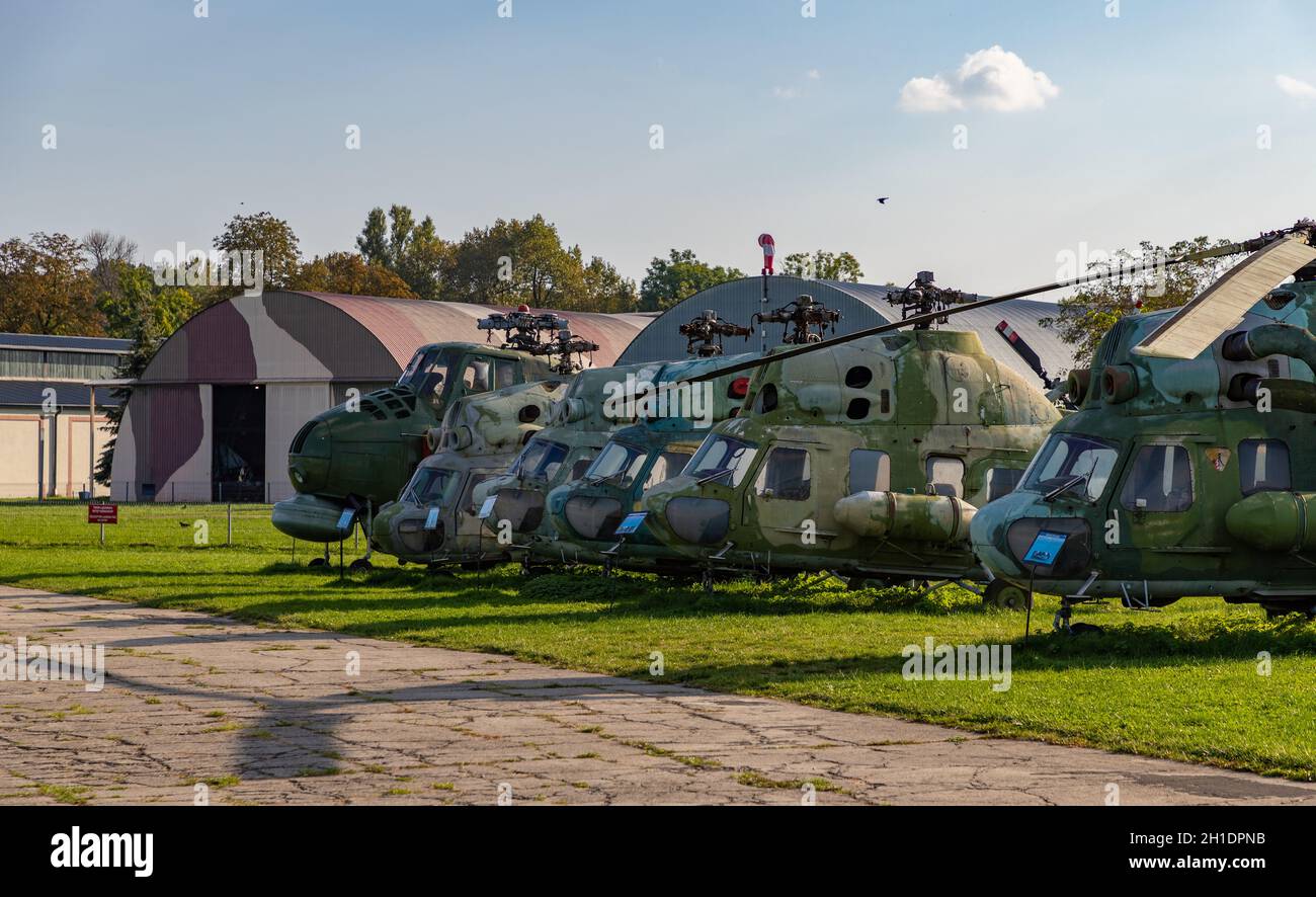A picture of a row of military helicopters on the grounds of the Polish Aviation Museum. Stock Photo