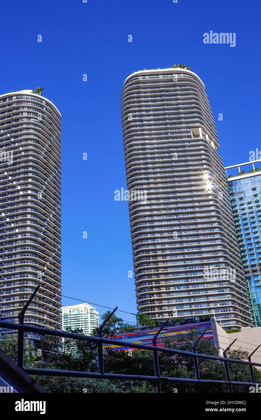 Miami, USA - November 30, 2019: Downtown Miami cityscape view with condos and office buildings against blue sky. Stock Photo