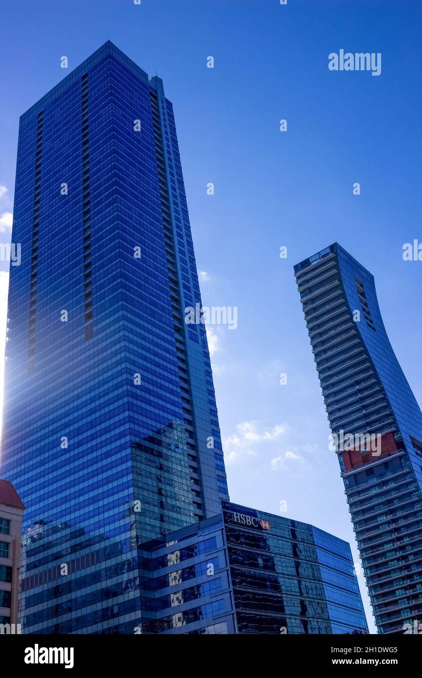 Miami, USA - November 30, 2019: Downtown Miami cityscape view with condos and office buildings against blue sky. Stock Photo