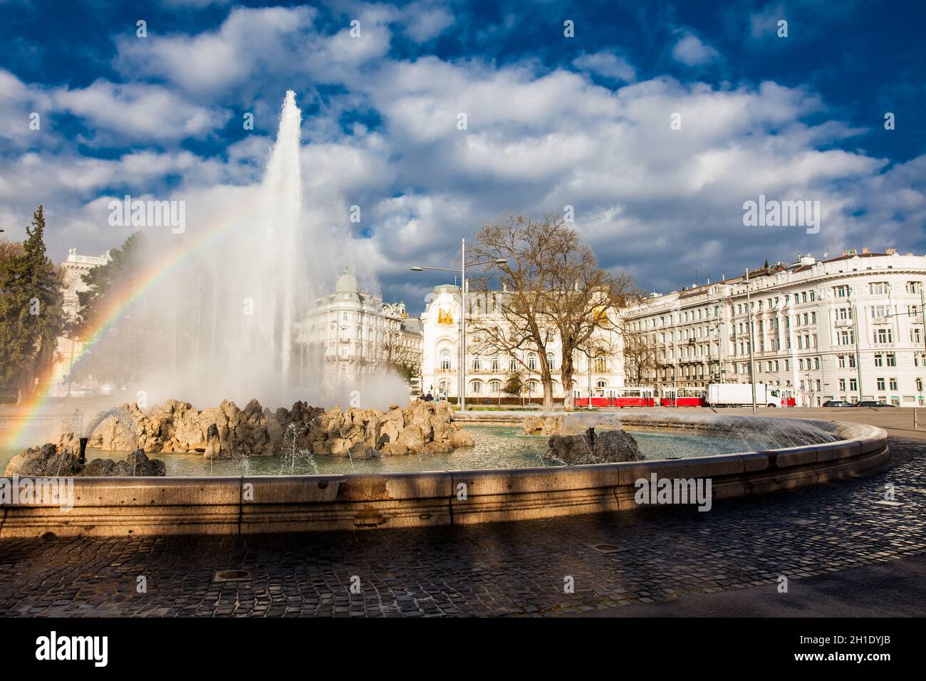 View of the beautiful buildings at Vienna city center and the fountain at Schwarzenbergplatz Stock Photo