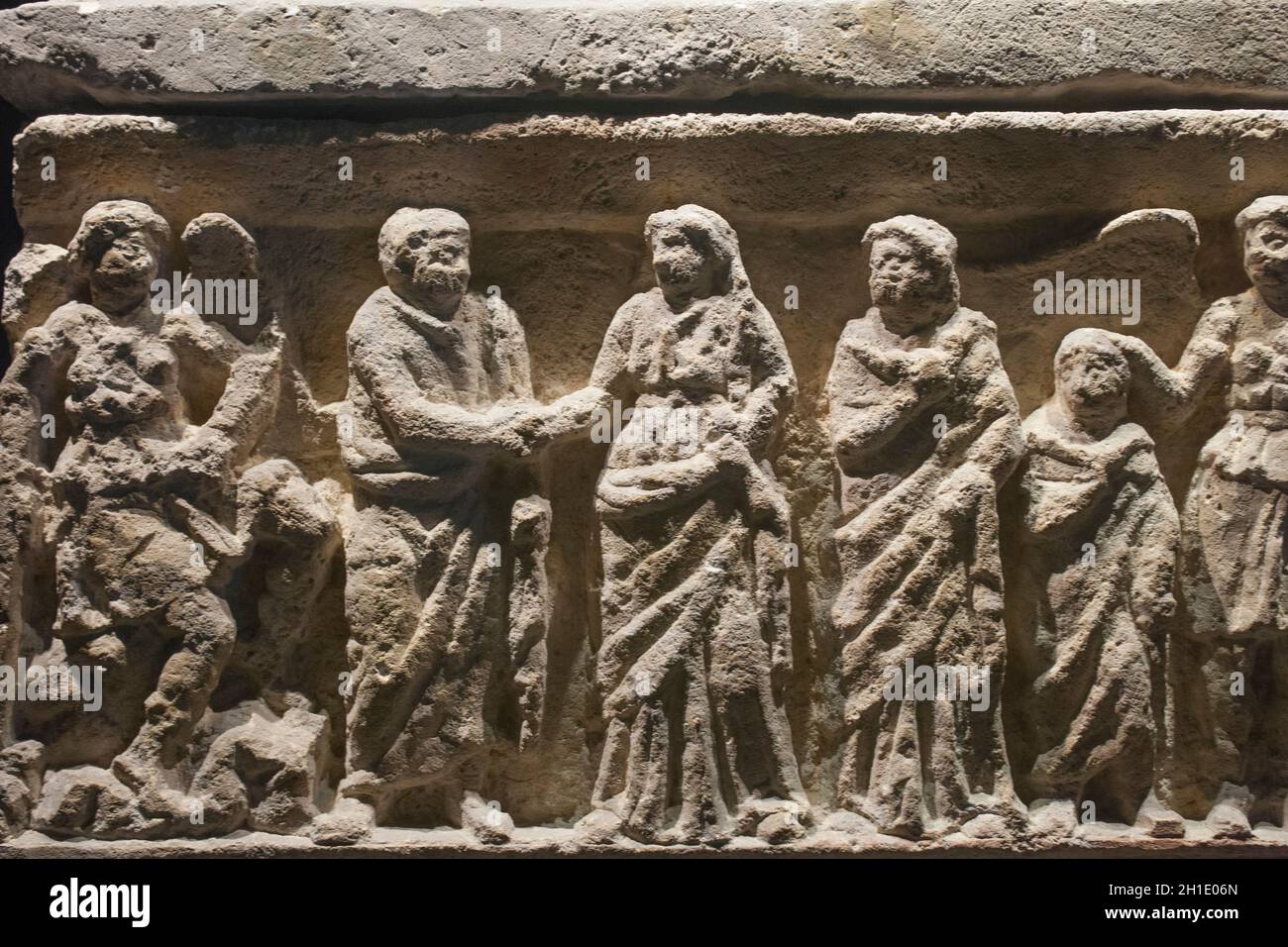 Barcelona, Spain - Dec 27th, 2019: Etruscan cineray urn on podium. Relief with matrona scene Stock Photo