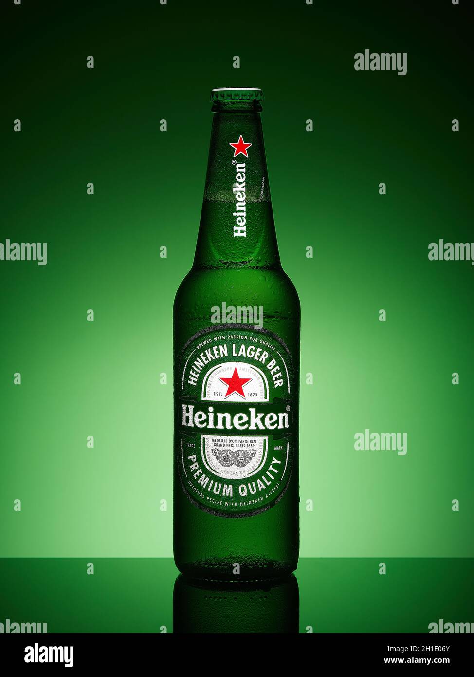 St.Petersburg, Russia - February 2020 -  Bottle of Heineken lager beer  on green gradient background. Stock Photo