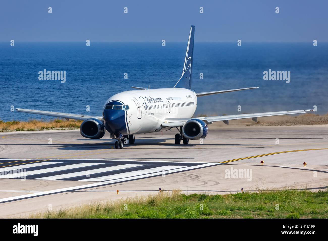 Skiathos, Greece – August 2, 2019: Blue Panorama Boeing 737-400 airplane at Skiathos airport (JSI) in Greece. Boeing is an American aircraft manufactu Stock Photo