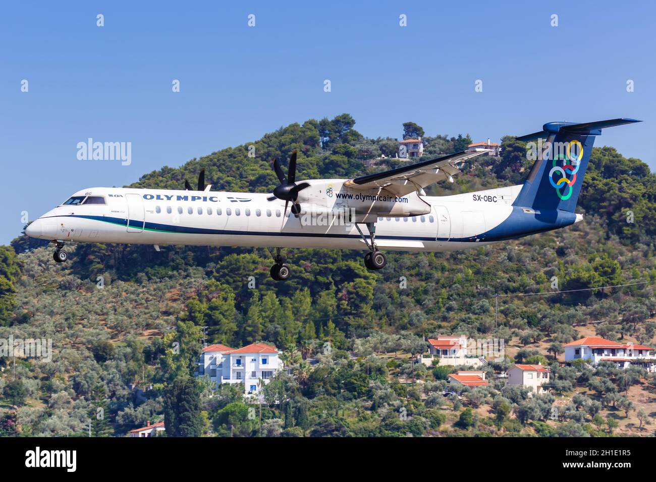 Skiathos, Greece – July 31, 2019: Olympic Air Bombardier DHC-8-400 airplane at Skiathos airport (JSI) in Greece. Stock Photo
