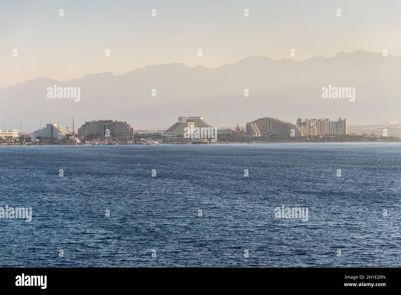 Eilat, Israel - November 7, 2017:  View from cargo port on Eilat city in the sand haze - famous tourist and resort place in Israel. Stock Photo