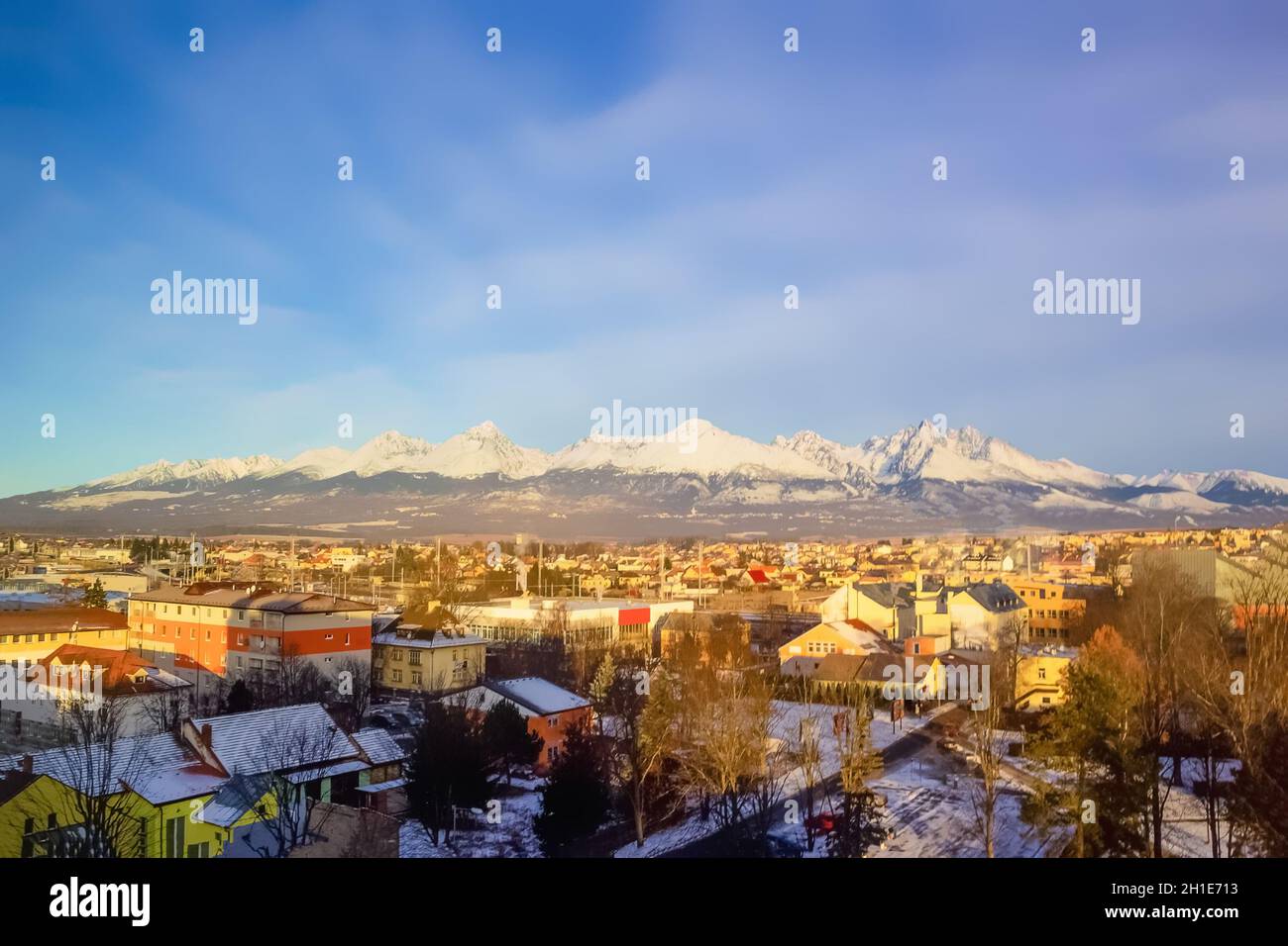 Mountains over colorful buildings and houses at Poprad, Slovakia. Morning Stock Photo