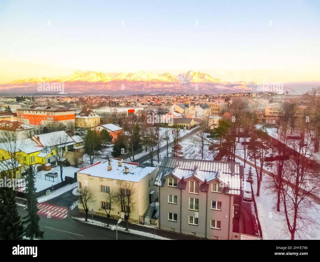 Mountains over colorful buildings and houses at Poprad, Slovakia. Morning Stock Photo