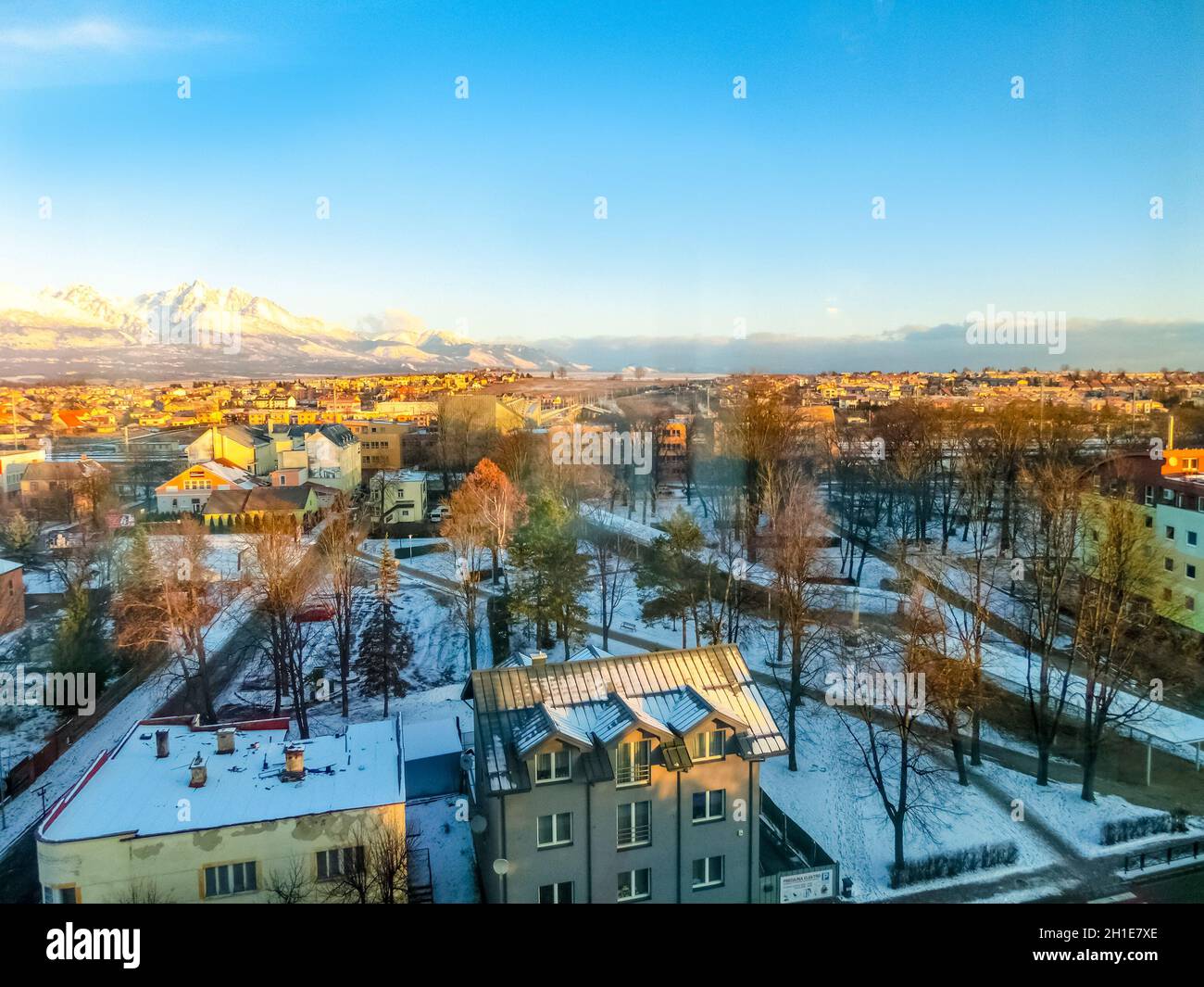 Mountains over colorful buildings and houses at Poprad, Slovakia. Morning Stock Photo