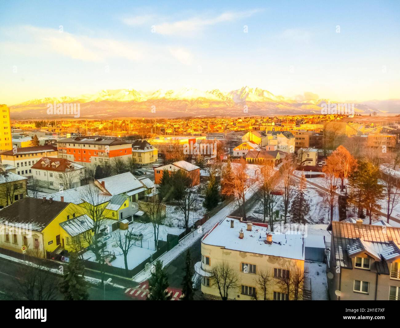 Mountains over colorful buildings and houses at Poprad, Slovakia. Morning Stock Photo