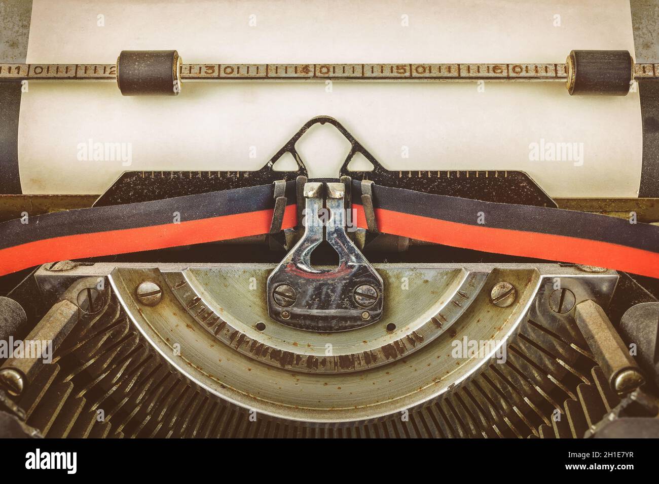 Red Vintage Typewriter With White Blank Paper Sheet Stock Photo