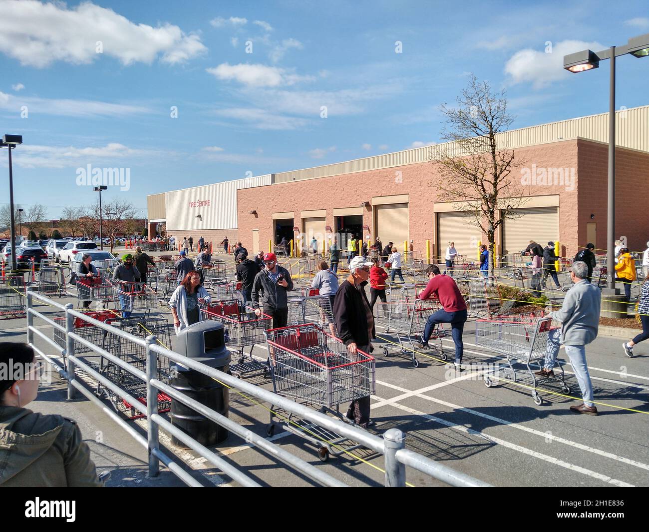 LANGLEY, CANADA - April 14, 2020. Shoppers line up in a giant costco shopping cart maze in order to get into the store during Covid-19 on April 14, 20 Stock Photo